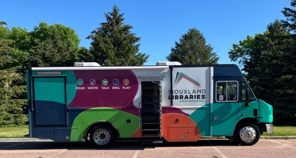 Our current Bookmobile, decorated in Siouxland Libraries colors.