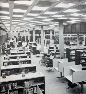 Interior of the newly-constructed Main Library downtown, with bookshelves and study carrels