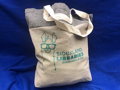canvas bag with Siouxland Libraries' llama mascot