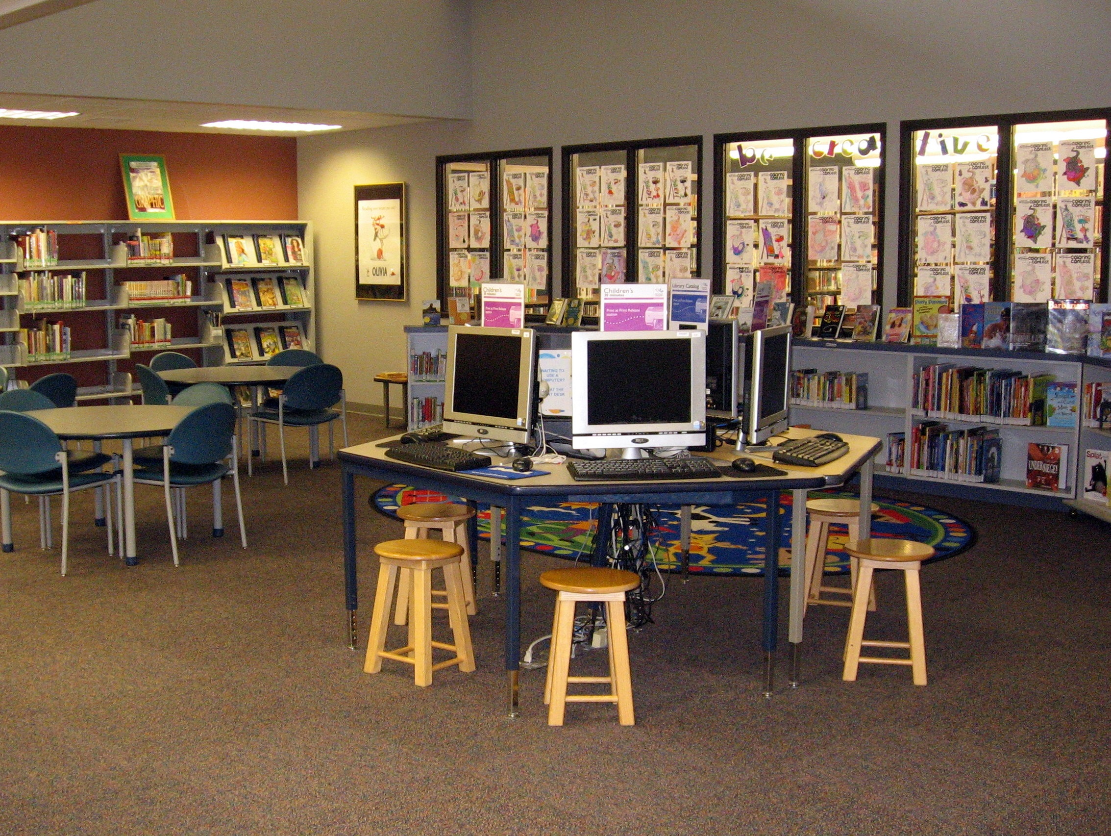 library interior displaying public computers in the children's area