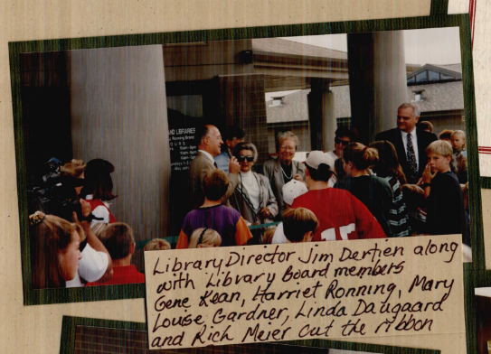 scrapbook page with a photo of a crowd standing outside of a library