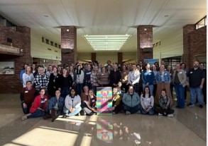 Siouxland Libraries staff group photograph in the lobby of the Downtown Library