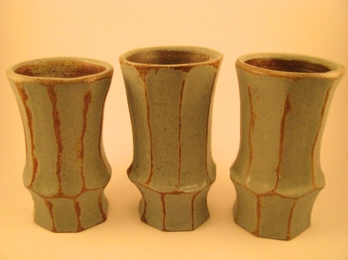 3 stoneware soda fired yellow and green faceted tumblers.
